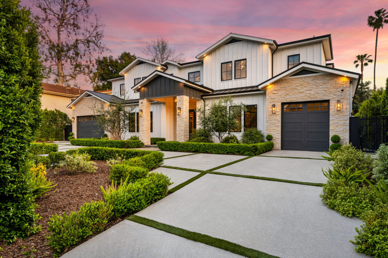 Modern farmhouse at sunset.