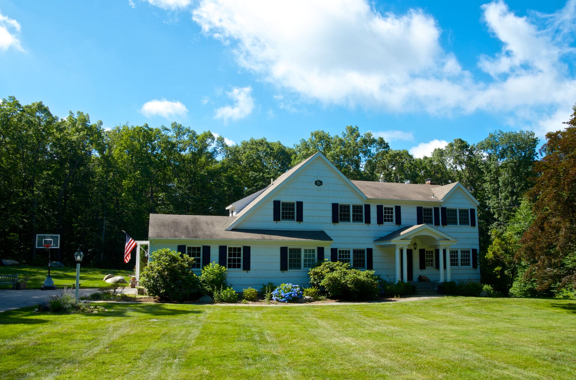 Suburban house with American flag.