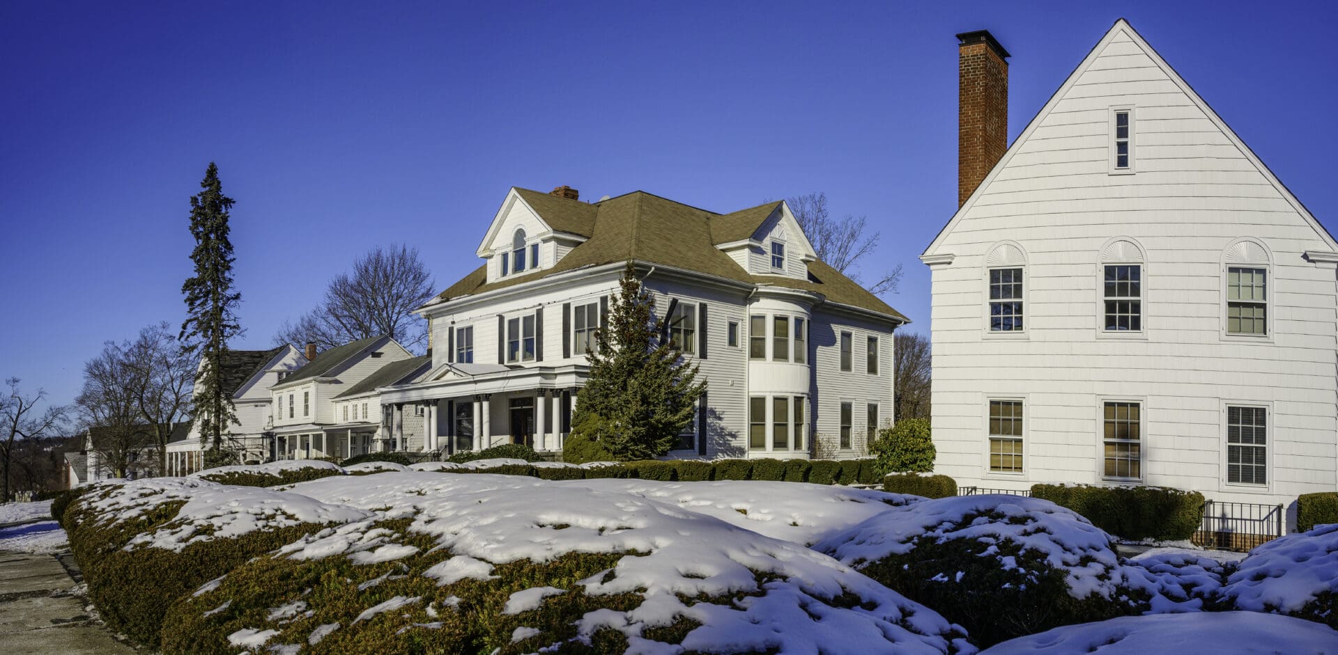 Snowy white houses on a sunny day.